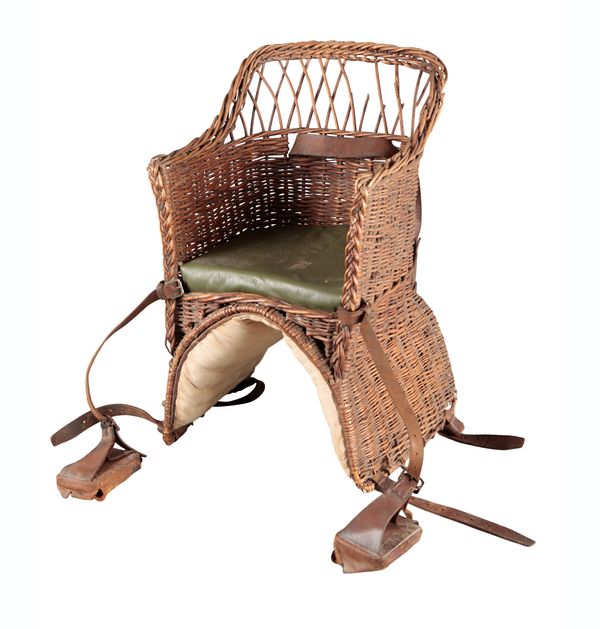 A CHILD'S WICKER RIDING SEAT