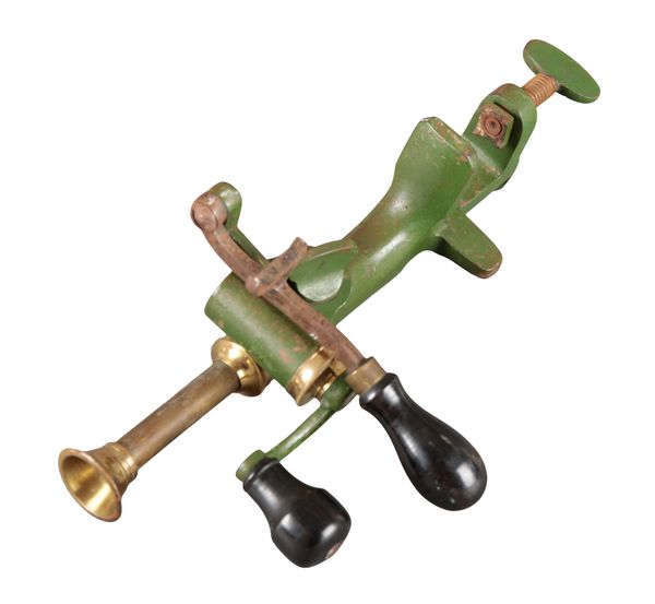 A 12 GUAGE BRASS AND CAST METAL RELOADING TOOL