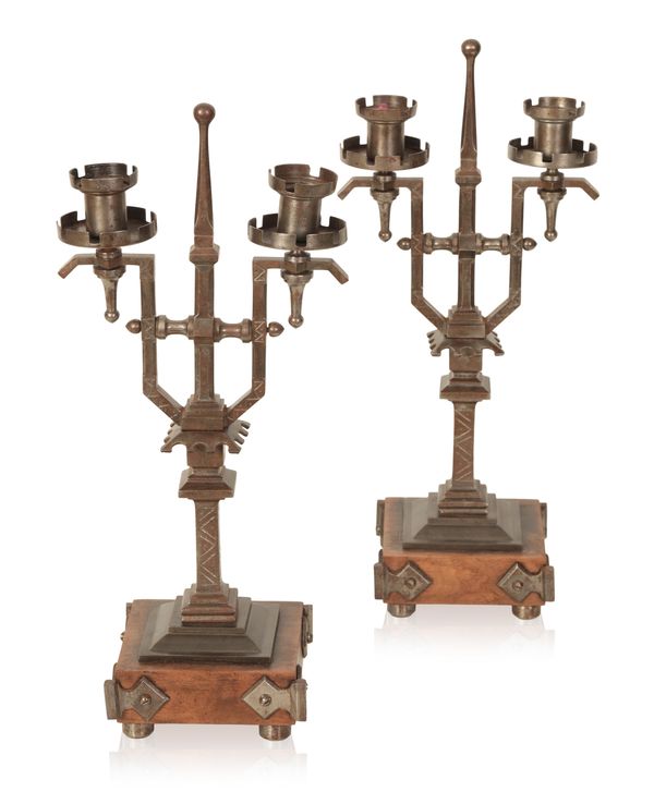 A PAIR OF ARTS AND CRAFTS STYLE CANDELABRA