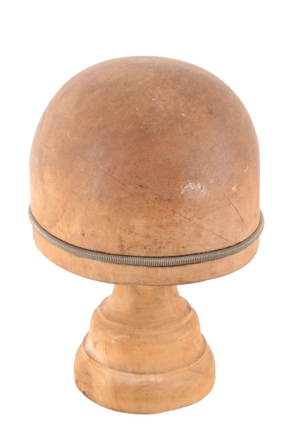A WOODEN HAT MOULD