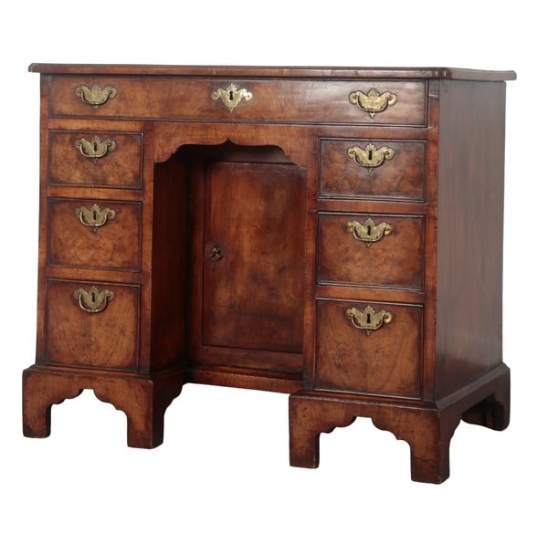 A GEORGE II WALNUT KNEEHOLE DESK