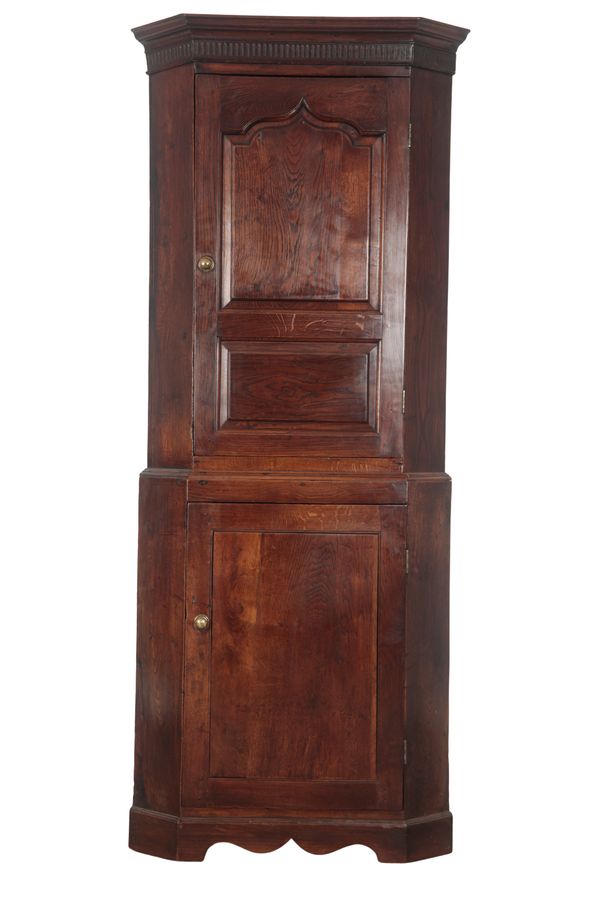 A PROVINCIAL OAK CORNER CUPBOARD