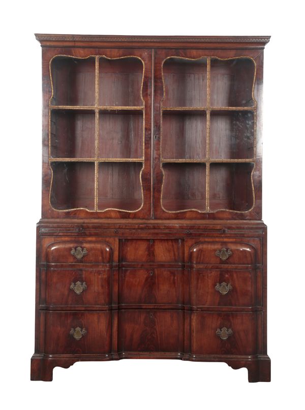 AN ANGLO-AMERICAN WALNUT AND PARCEL-GILT BOOKCASE