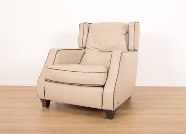 A MODERN BEIGE LEATHER HIGH-BACKED ARMCHAIR BY NATUZZI