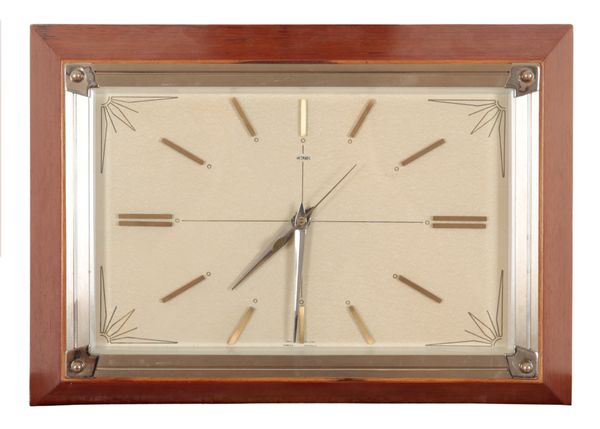 A MID-CENTURY METAMEC WALL CLOCK