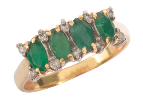 AN EMERALD AND DIAMOND FOUR STONE RING