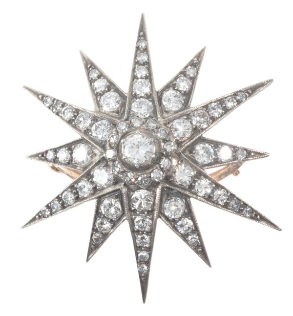 A DIAMOND STAR BROOCH