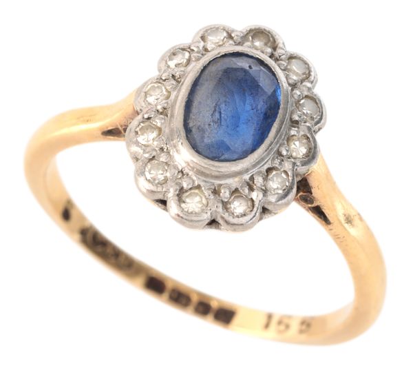 A SAPPHIRE AND DIAMOND CLUSTER RING