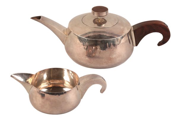 AN ELIZABETH II ‘MODERNIST’ SILVER TEAPOT AND MILK JUG
