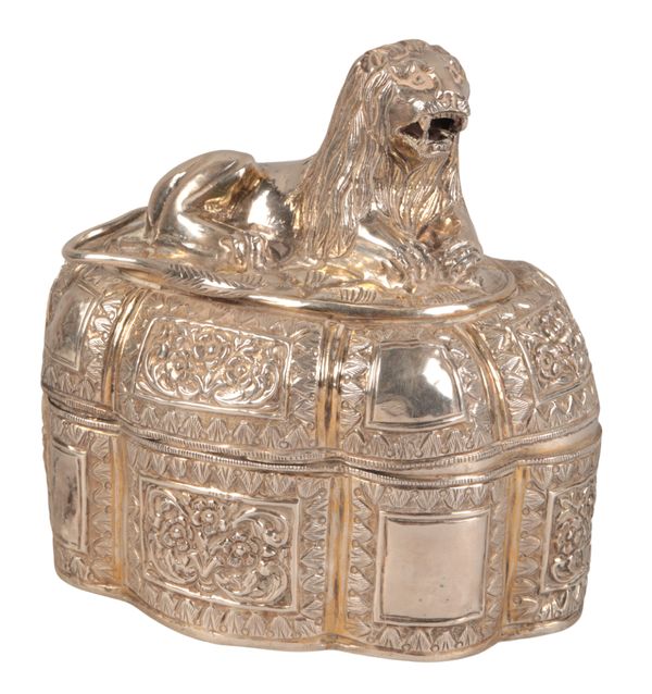 AN EASTERN GILT WHITE METAL OVAL LIDDED BOX