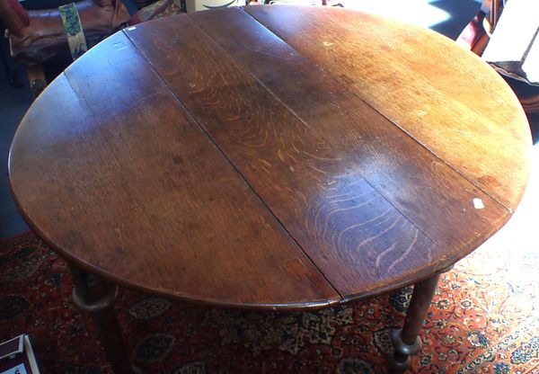 AN OAK DROP FLAP DINING TABLE