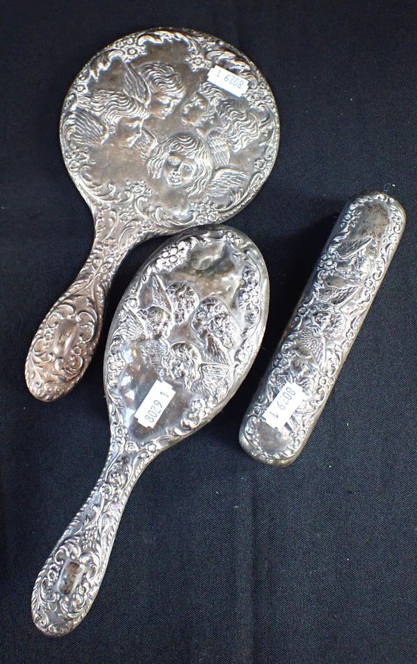 AN EDWARDIAN SILVER THREE PIECE HAIRBRUSH SET