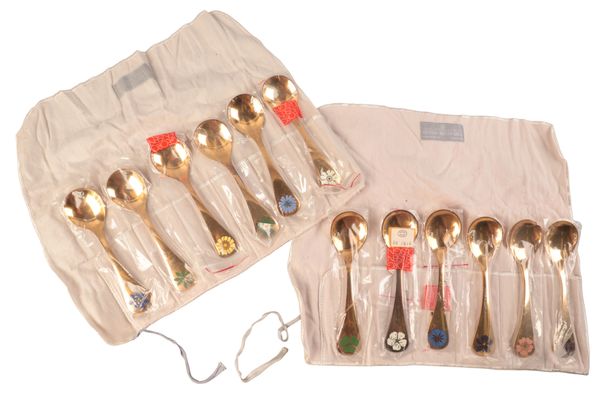 TWELVE GEORG JENSEN ‘FLORAL SERIES’ ENAMELLED SILVER GILT SPOONS