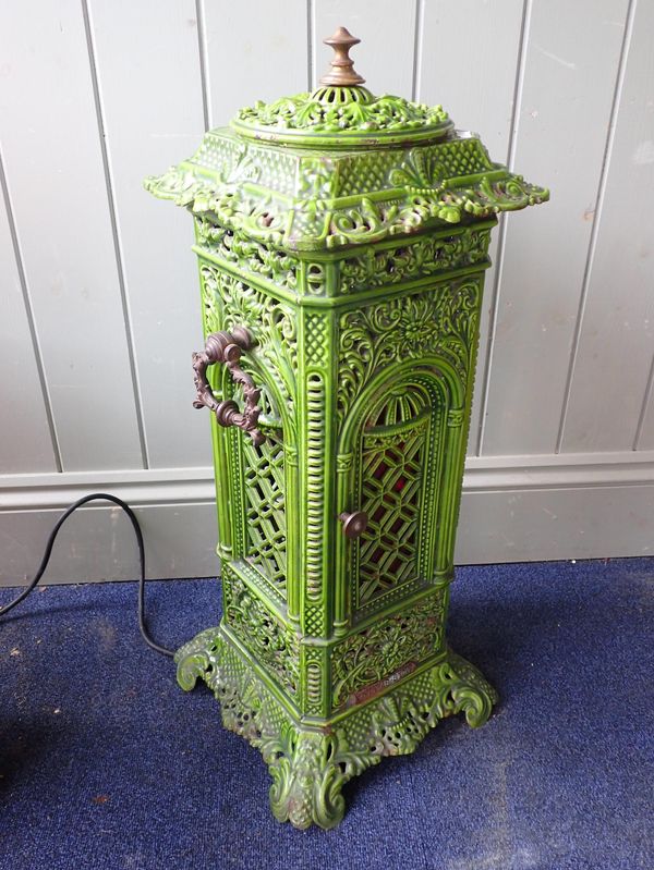 A GREEN ENAMELLED CAST IRON CONSERVATORY STOVE