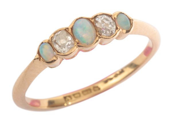 AN OPAL AND DIAMOND FIVE STONE RING