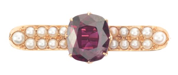 A GARNET AND PEARL BROOCH