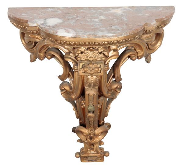 A GILTWOOD AND COMPOSITION WALL BRACKET