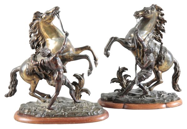 AFTER GUILLAUME I COUSTOU (1677-1746) A pair of brass marly horses