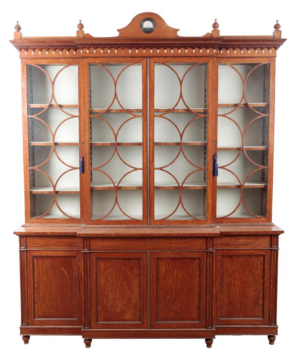 A SATINWOOD BREAKFRONT BOOKCASE IN THE MANNER OF THOMAS SHERATON