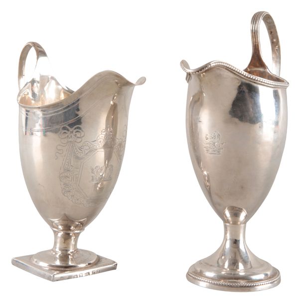 A GEORGE III SILVER HELMET SHAPE CREAM JUG