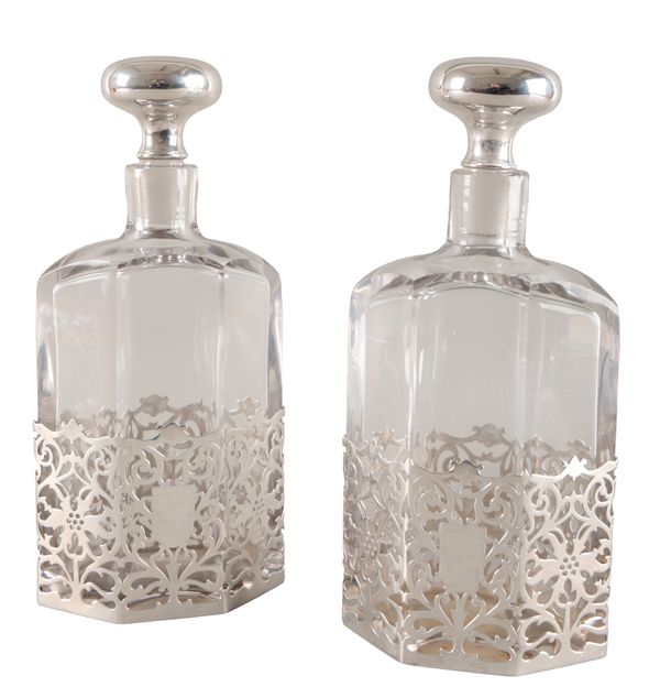 A PAIR OF GEORGE V SILVER MOUNTED CUT GLASS DECANTERS