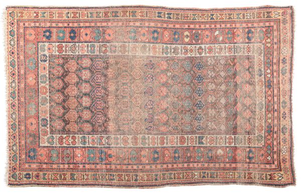 AN ANTIQUE PERSIAN RUG