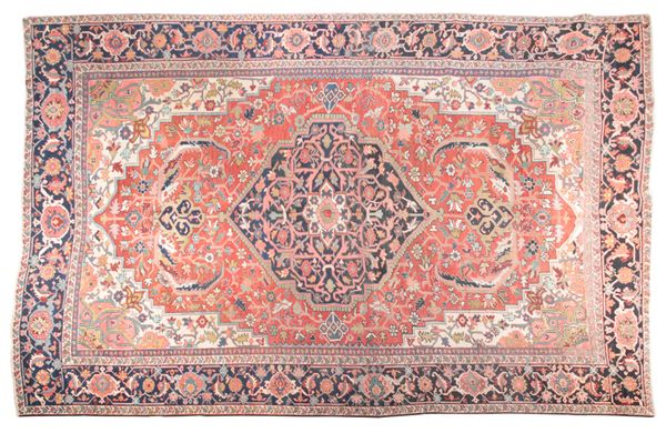 AN ANTIQUE PERSIAN HERIZ CARPET