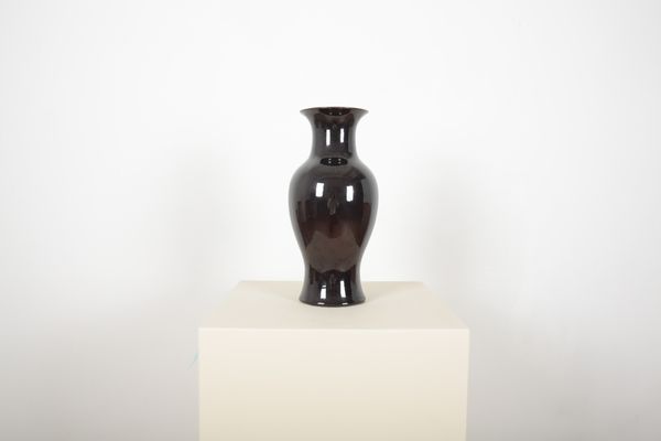 A HAEGER DEEP RED-BLACK POTTERY BALUSTER VASE