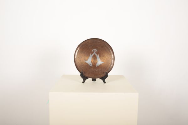HUGH WALLIS (BRITISH, 1871-1942) An Arts and Crafts copper and pewter inlaid circular tray