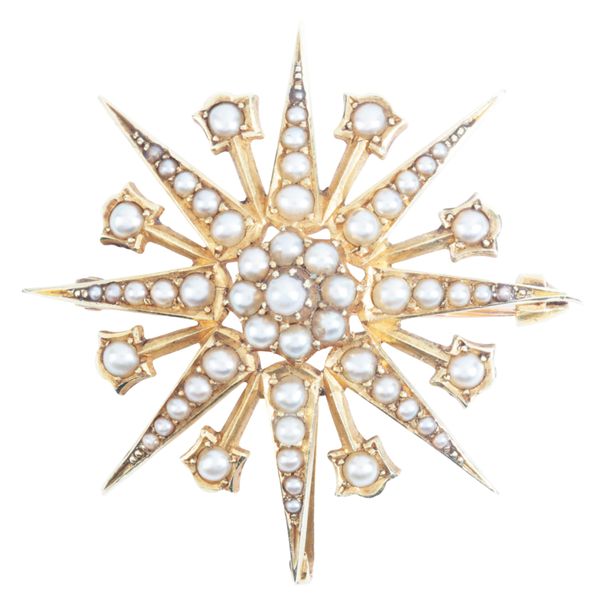 AN ANTIQUE STAR BROOCH