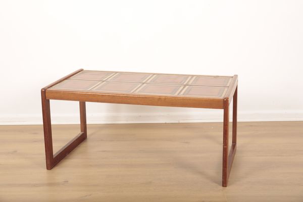 A MID-CENTURY TEAK RECTANGULAR TILE TOP TABLE