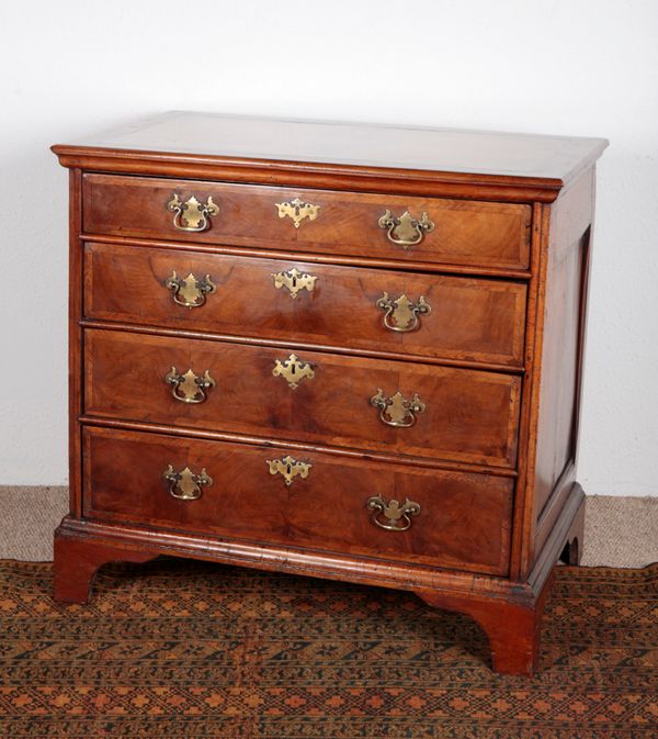 A QUEEN ANNE WALNUT CHEST OF DRAWERS