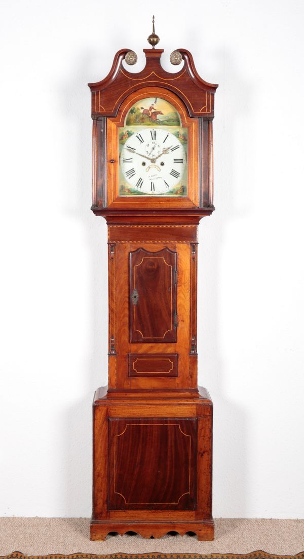 A REGENCY MAHOGANY LONGCASE CLOCK