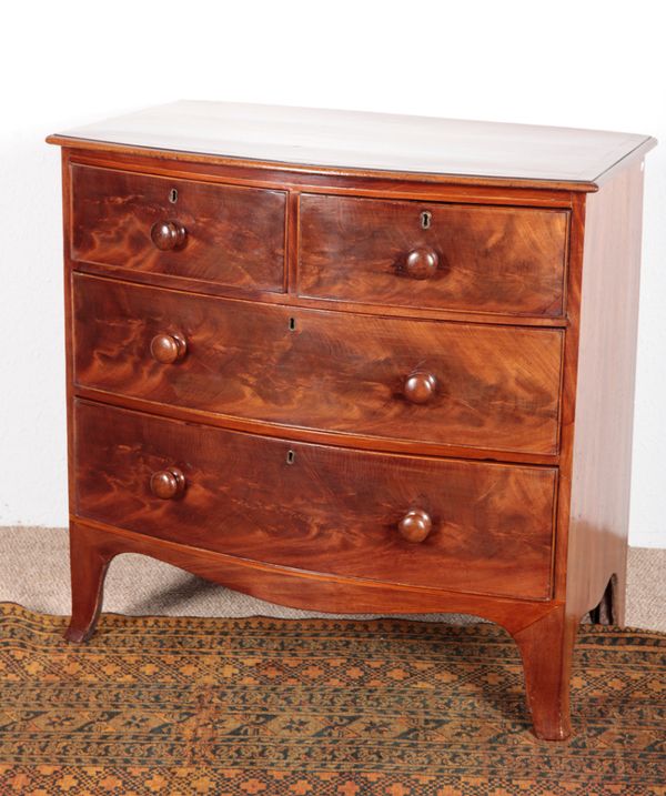 A REGENCY MAHOGANY BOWFRONT CHEST OF DRAWERS