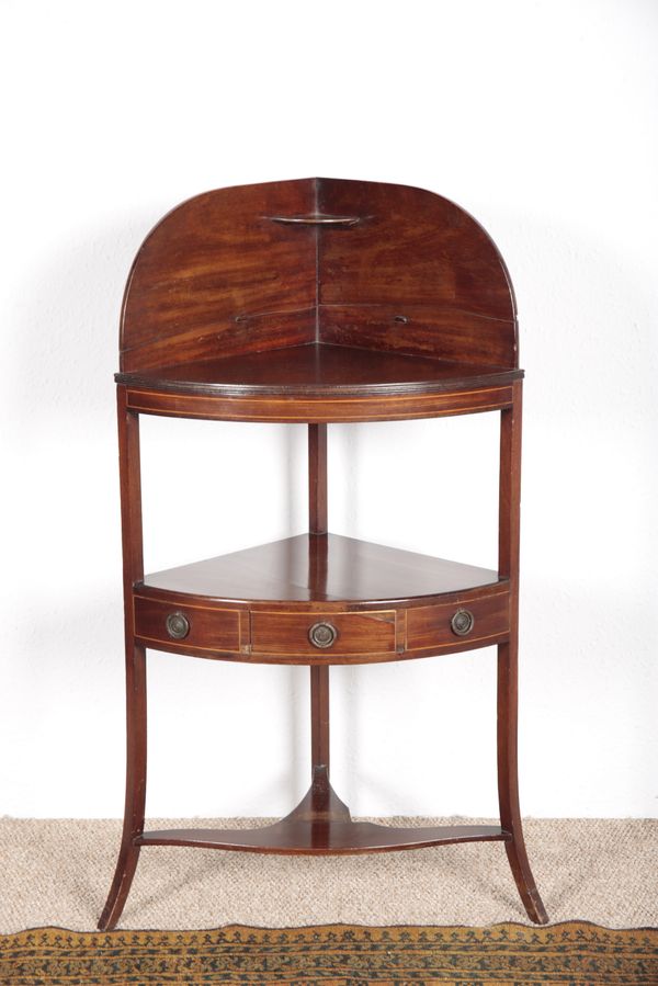 A REGENCY MAHOGANY BOWFRONT CORNER WASHSTAND