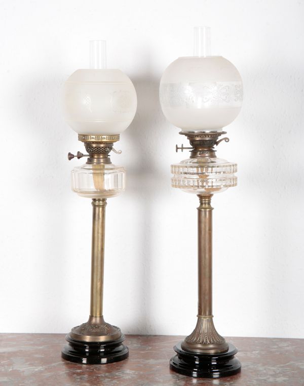 A NEAR PAIR OF VICTORIAN OIL LAMPS