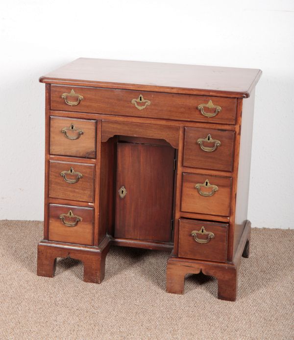 A GEORGE III MAHOGANY KNEEHOLE DESK