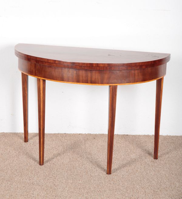 A GEORGE III MAHOGANY DEMI-LUNE CARD TABLE