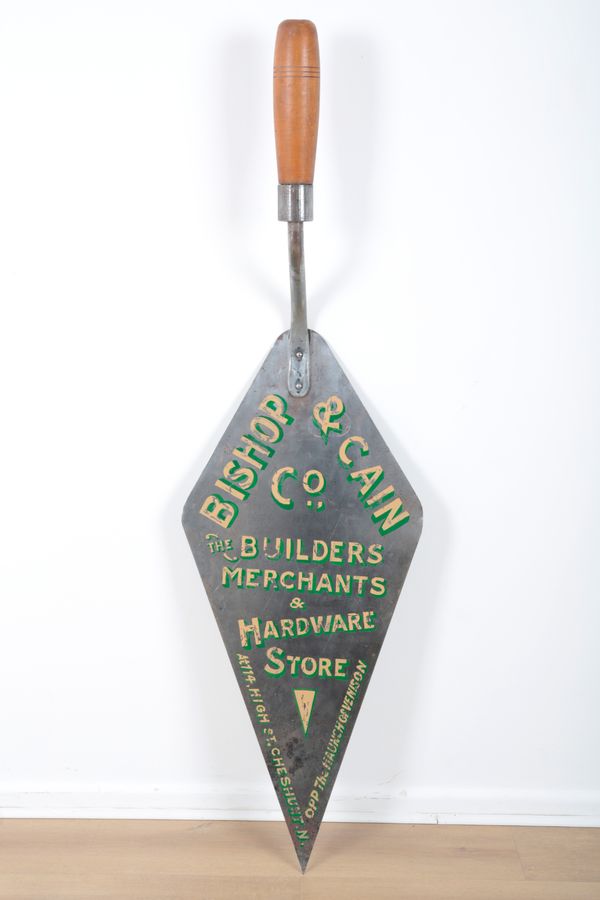 BISHOP & CAIN CO.: A GIANT TROWEL ADVERTISING SIGN FOR 'THE BUILDERS MERCHANTS & HARDWARE STORE'