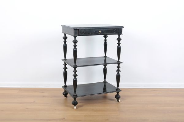 A VICTORIAN EBONISED WHATNOT