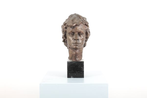 FROSCH (?): A PATINATED BRONZE HEAD OF A LADY