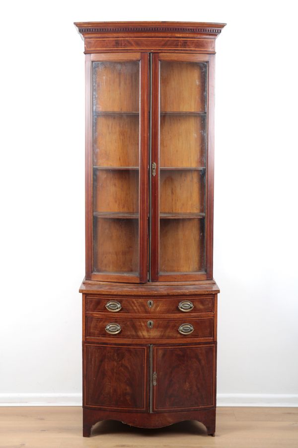 AN EDWARDIAN MAHOGANY AND GLAZED BOWFRONT BOOKCASE CABINET