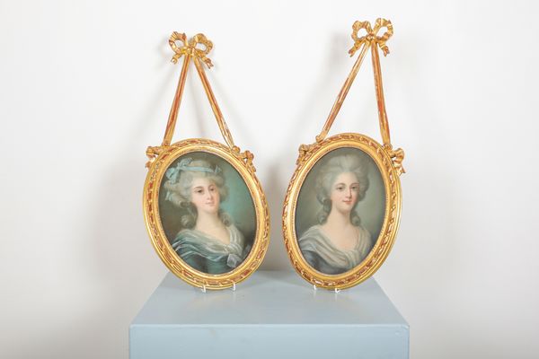 A PAIR OF PORTRAITS OF LADIES IN GILTWOOD FRAMES