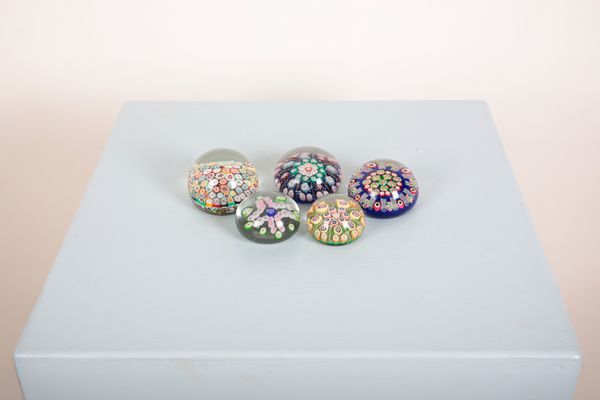 A GROUP OF FIVE GLASS MILLEFIORI PAPER WEIGHTS