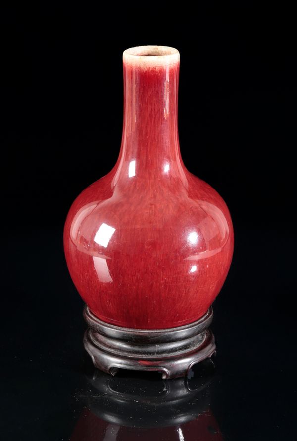 A CHINESE PORCELAIN FLAMBE GLAZED BOTTLE VASE