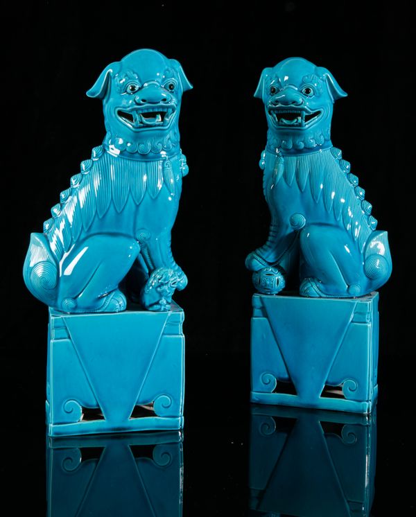 A PAIR OF CHINESE TURQUOISE GLAZED DOGS OF FO