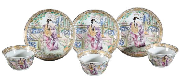 A SET OF THREE CHINESE PORCELAIN FAMILLE ROSE TEA BOWLS AND SAUCERS