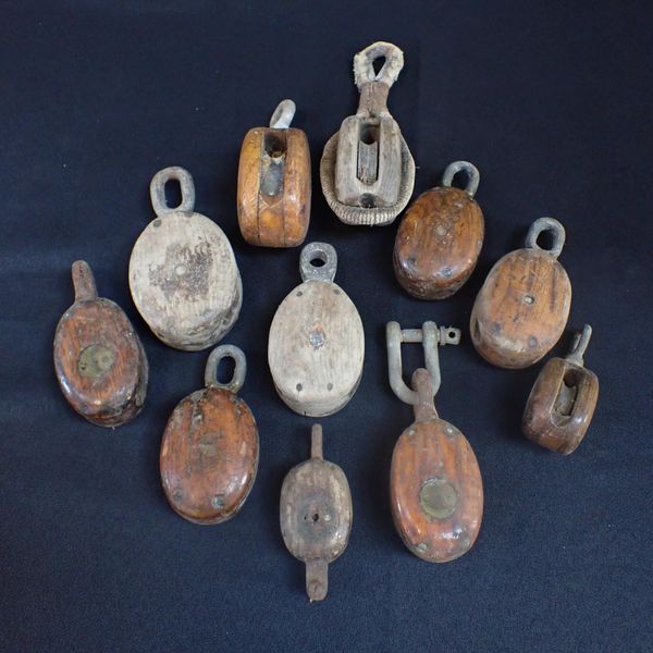 A COLLECTION OF SHIP'S BLOCKS AND PULLEYS