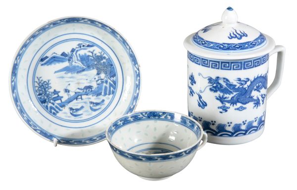 A CHINESE PORCELAIN BLUE AND WHITE 'RICE PATTERN' TEA CUP AND SAUCER