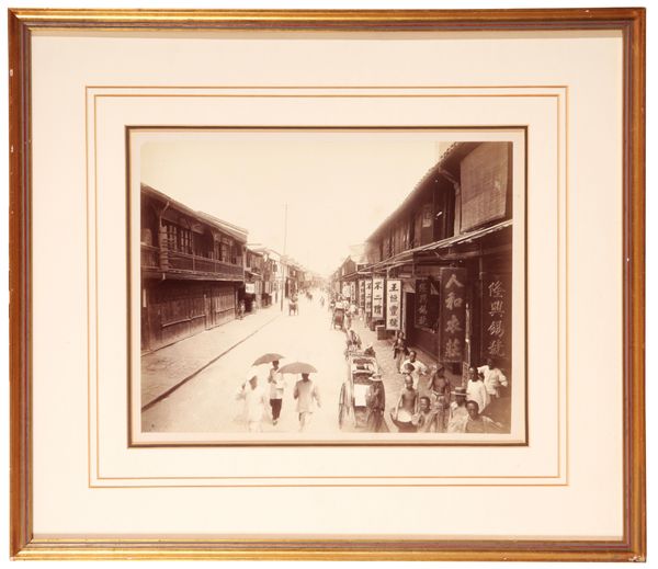 CHINESE SCHOOL, LATE 19TH/EARLY 20TH CENTURY A photograph of a busy street